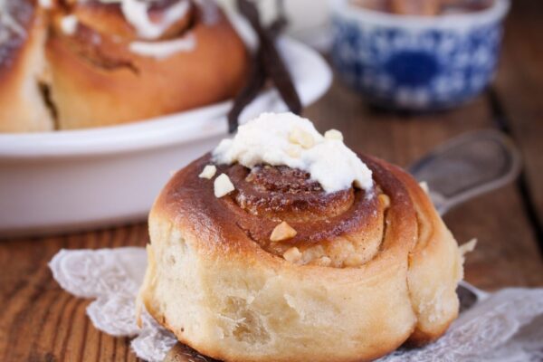 Homemade glazed cinnabons with cinnamon and almonds, american kitchen